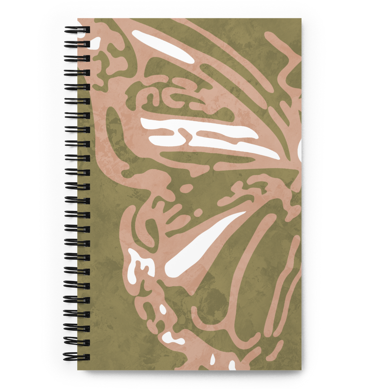 Picture of a green notebook with half of a coral colored butterfly with detailed wings.
