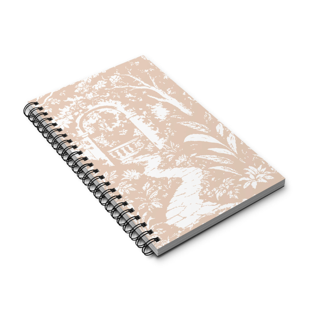 A spiral-bound notebook with a beige cover featuring a white toile-style pattern of a garden archway and foliage, shown on a clean white background.