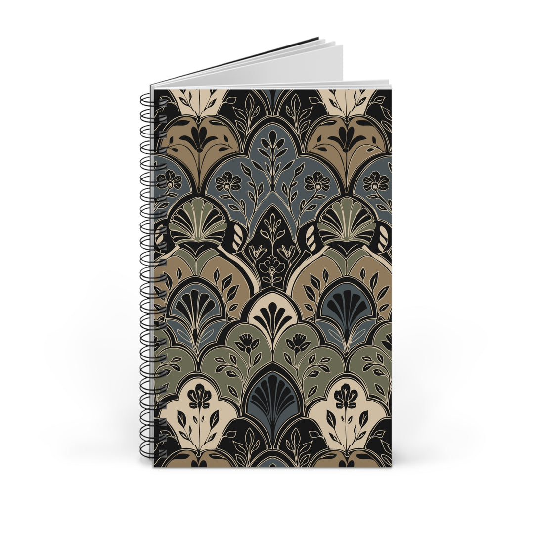 A spiral-bound notebook with a vintage Art Deco style pattern on the cover, featuring shades of beige, slate blue, olive green, and black, shown on a clean white background.