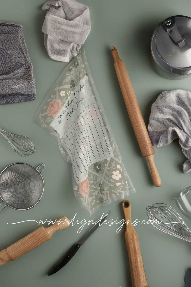 Baking tools and utensils on a green surface with 'www.dignidesigns.com' branding.