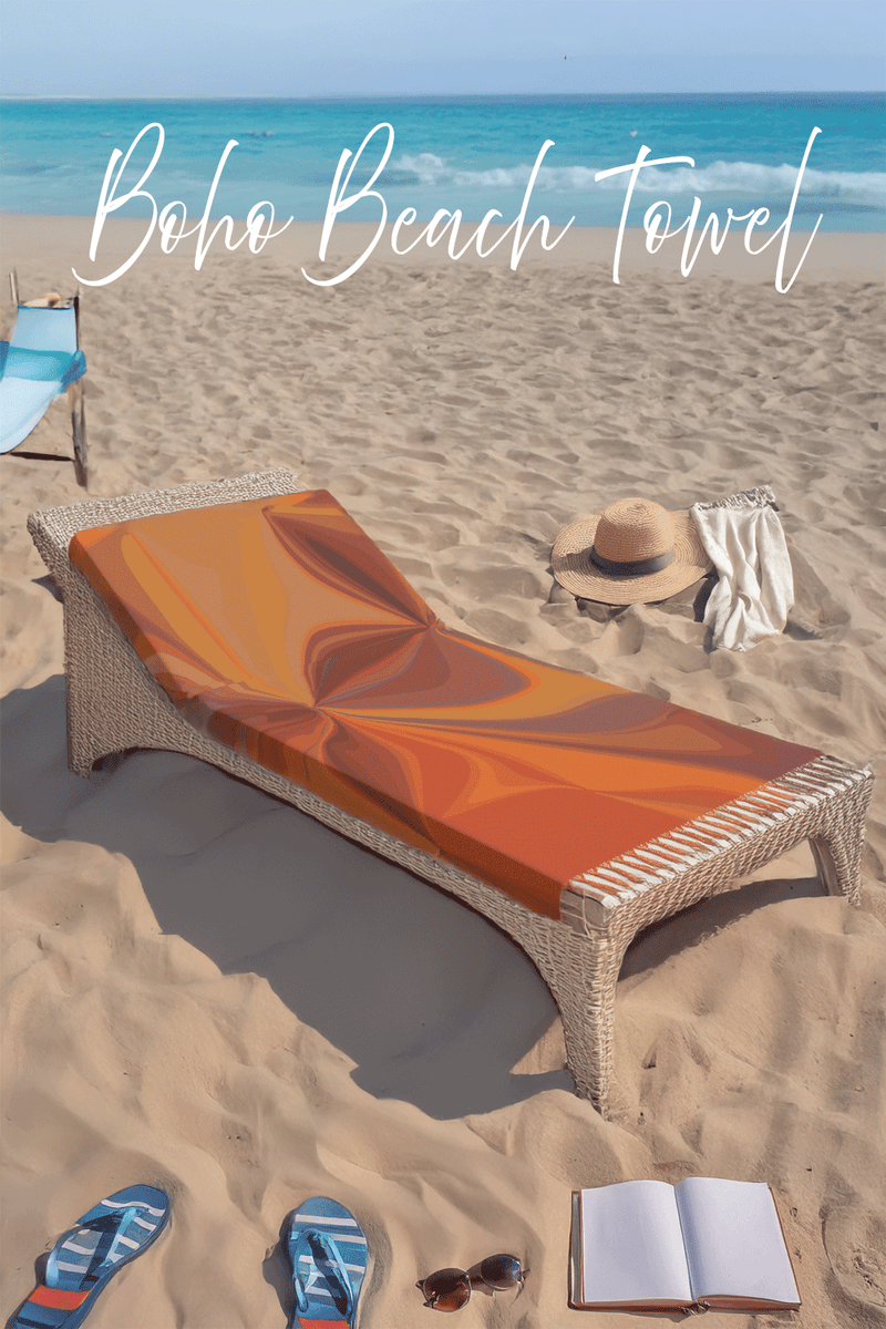 Boho beach towel on a lounge chair with beach accessories on sand and ocean background
