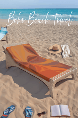 Boho beach towel on a lounge chair with beach accessories on sand and ocean background