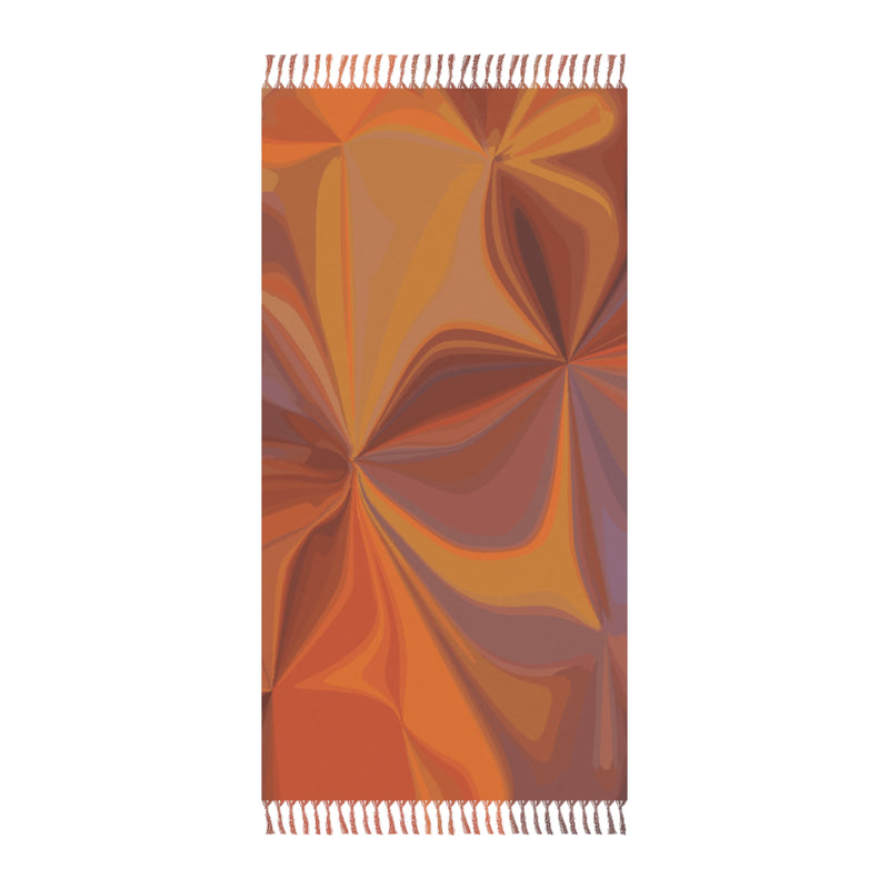 Colorful patterned towel with fringed edges on a white background