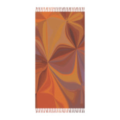 Colorful patterned towel with fringed edges on a white background