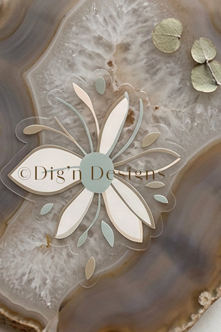 Decorative flower design on a textured surface with Dig'n Designs logo.