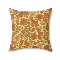 Decorative pillow with floral and paisley pattern on a beige background