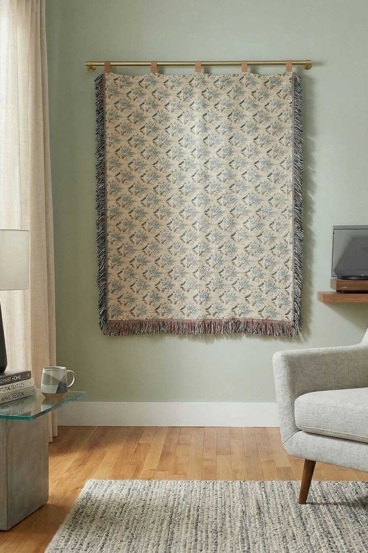 Decorative tapestry hanging on a wall in a living room setting.