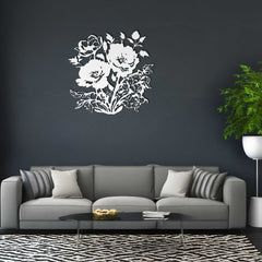 Gray sofa with decorative pillows against a dark wall with a floral design.