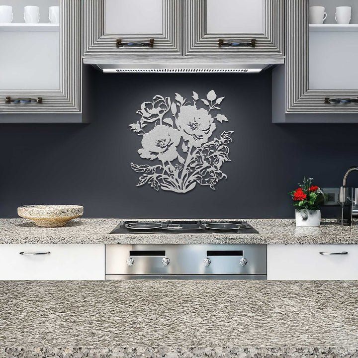 Modern kitchen with floral wall decal, stainless steel appliances, and granite countertops.