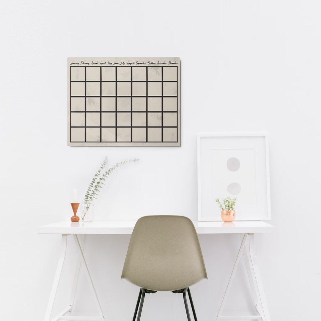 Dry erase reusable metal wall calendar on office wall