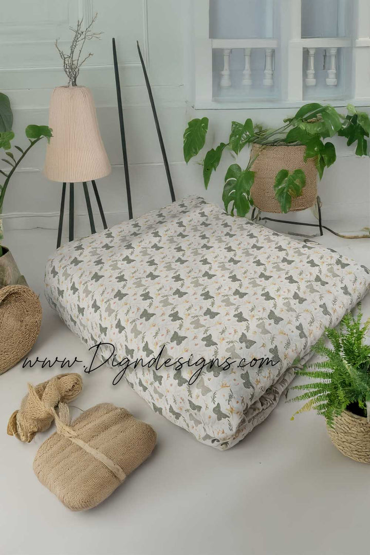 Floral-patterned cushion on a white surface with decorative elements and &