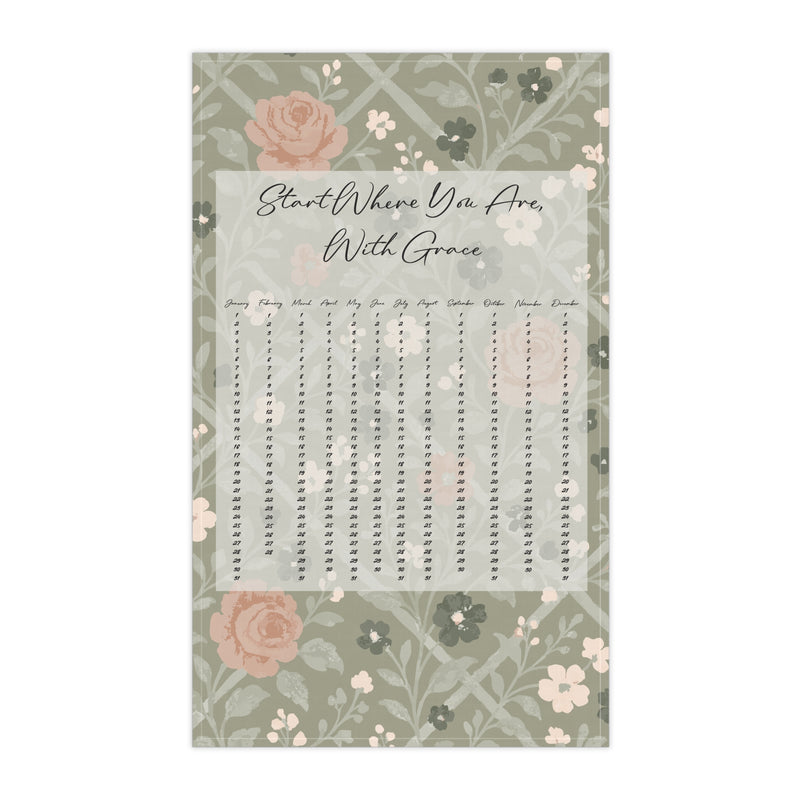 Floral-patterned tea towel with text on a white background