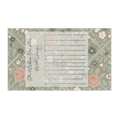 Floral-patterned tea towel with text on a white background