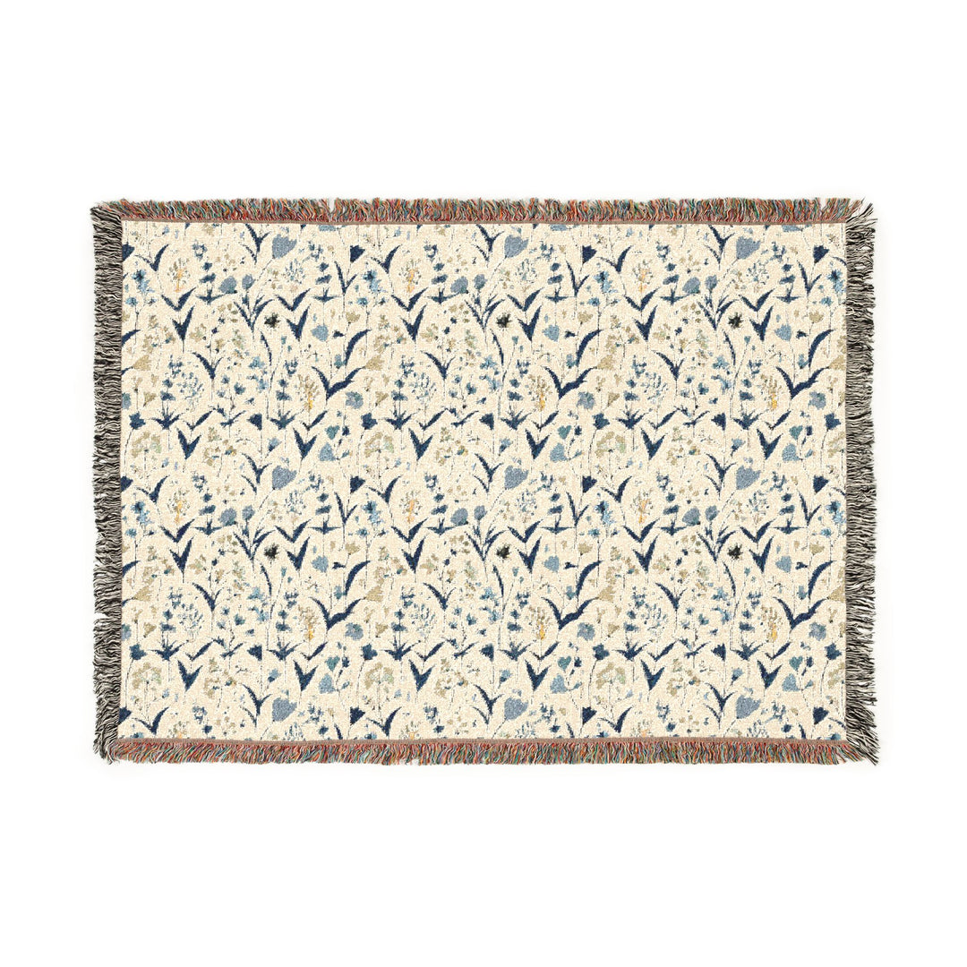 Floral patterned throw blanket on a white background