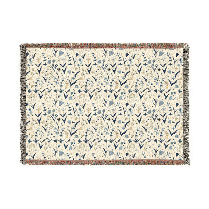 Floral patterned throw blanket on a white background
