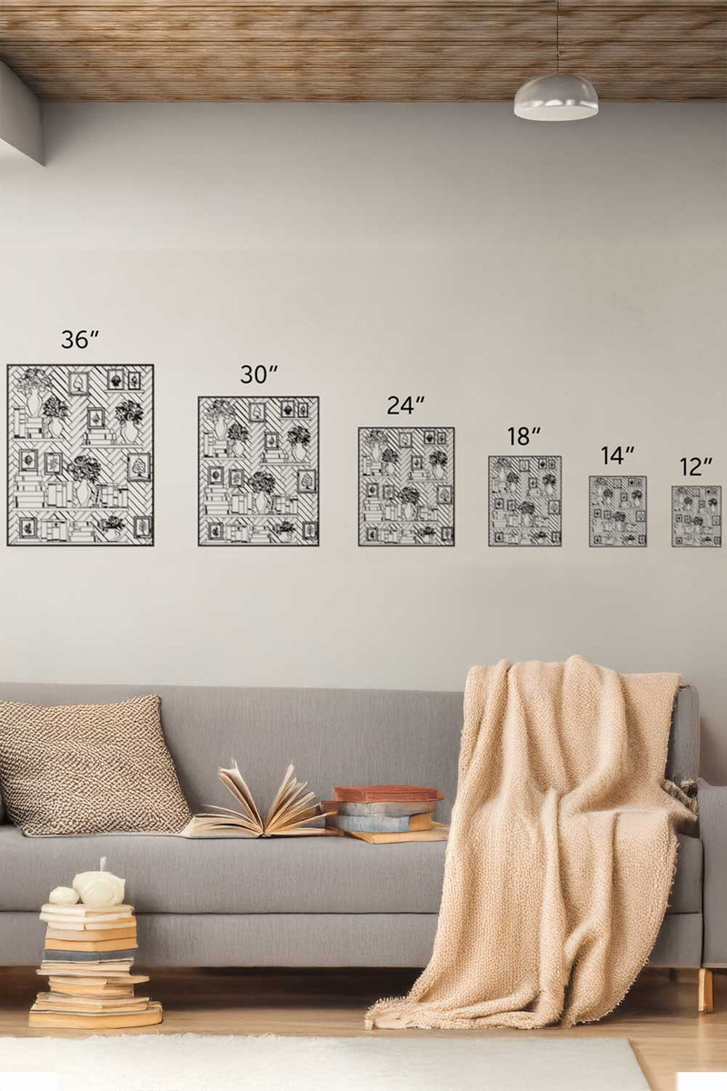 Living room with gray sofa, beige blanket, and decorative items on a light gray wall with framed artwork.