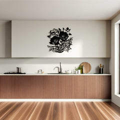 Modern kitchen with wooden cabinets and a decorative black floral wall decal.