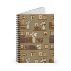 Notebook with a decorative cover featuring books, vases, and flowers on a beige background.