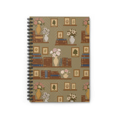 Notebook with a decorative cover featuring books, vases, and flowers on a beige background