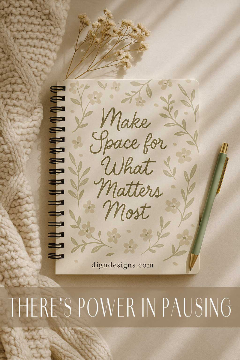 Notebook with decorative cover and pen on textured surface