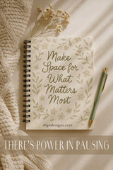 Notebook with decorative cover and pen on textured surface