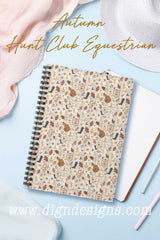 Notebook with equestrian pattern on a light blue background, featuring 'Autumn Hunt Club Equestrian' text and Dign Designs website.