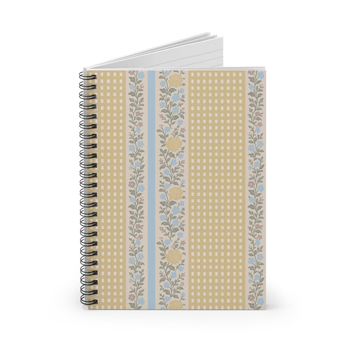 Notebook with floral and checkered design on a white background