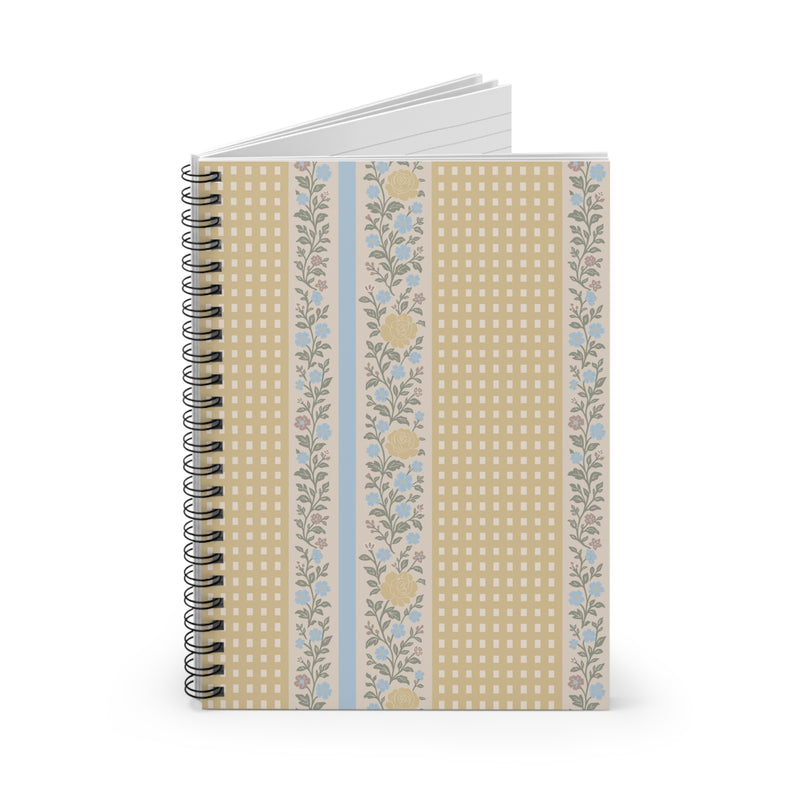 Notebook with floral and checkered design on a white background