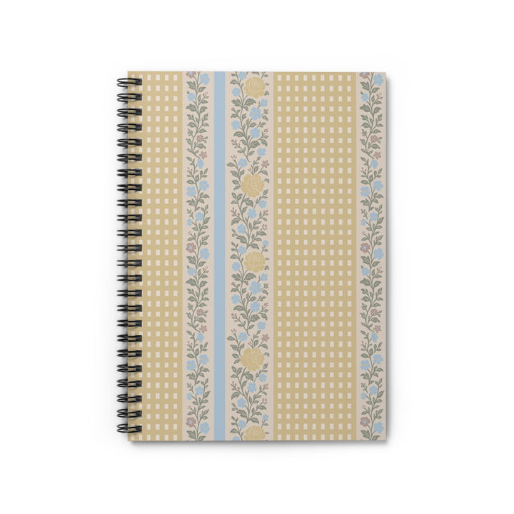 Notebook with floral and checkered design on a white background