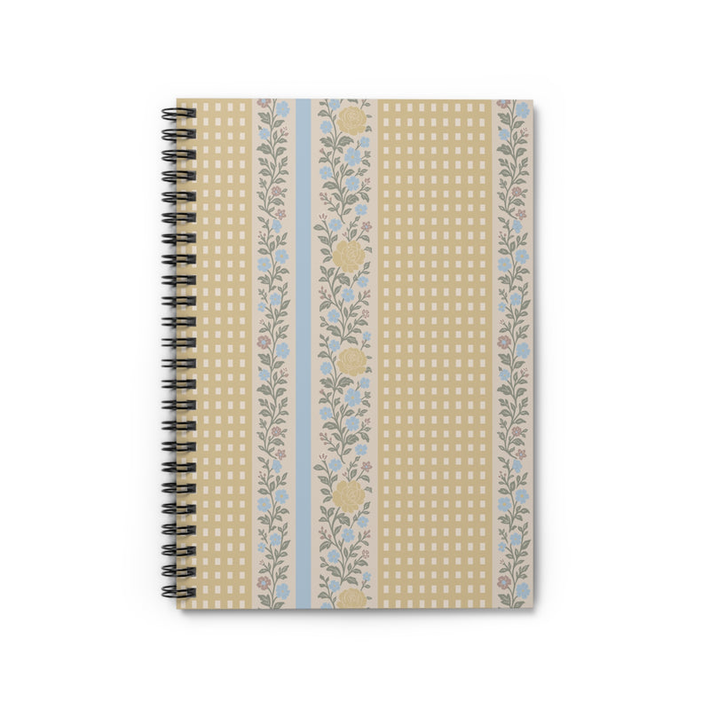 Notebook with floral and checkered design on a white background