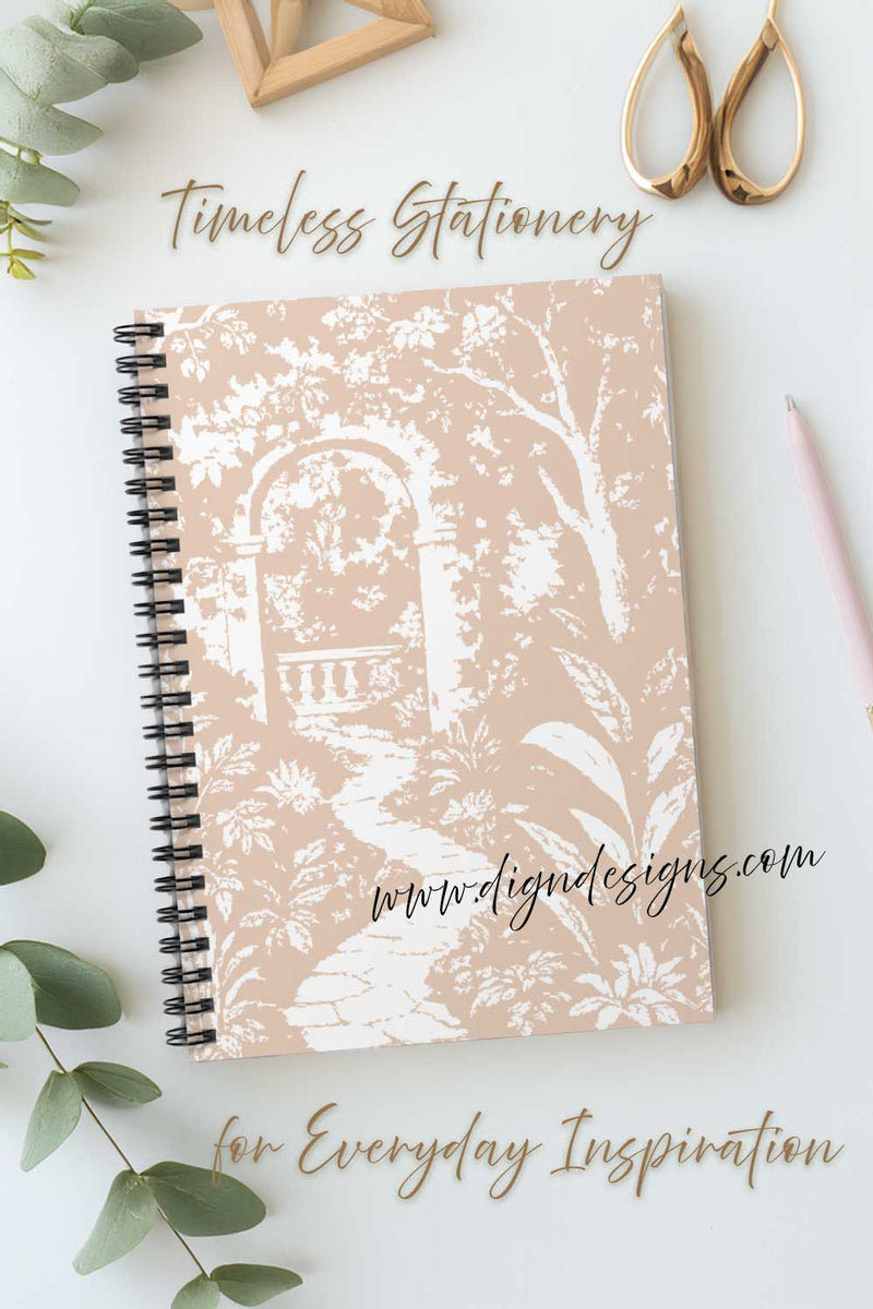 Notebook with floral design on a white surface with decorative elements