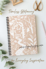 Notebook with floral design on a white surface with decorative elements