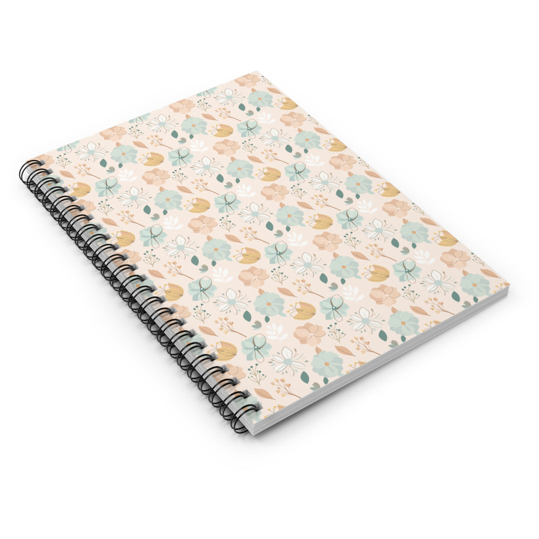 Spiral-bound notebook with a floral pattern on a white background