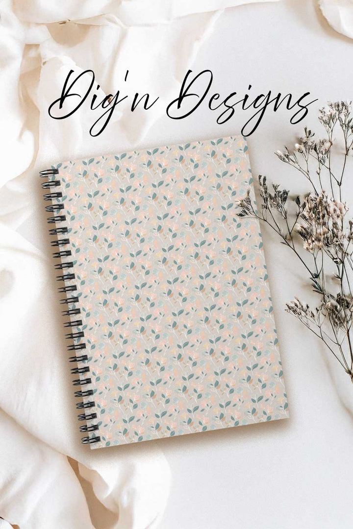 Notebook with floral pattern on a white surface with &