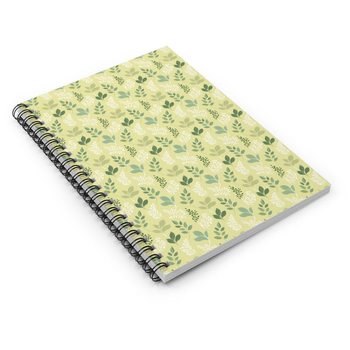 Notebook with green leaf pattern on a white backgroundb
