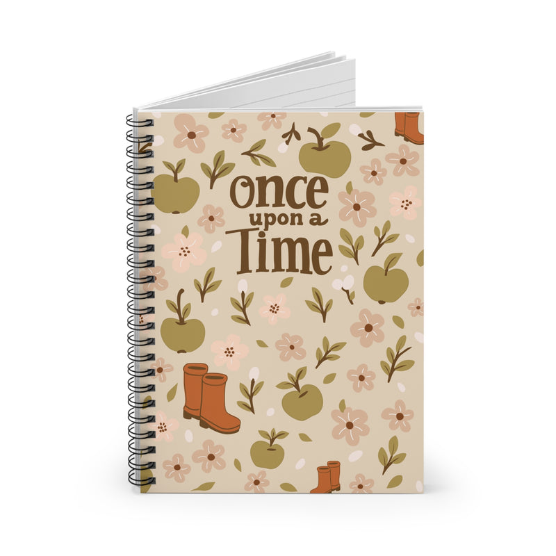Notebook with 'once upon a time' text and floral design on a white background