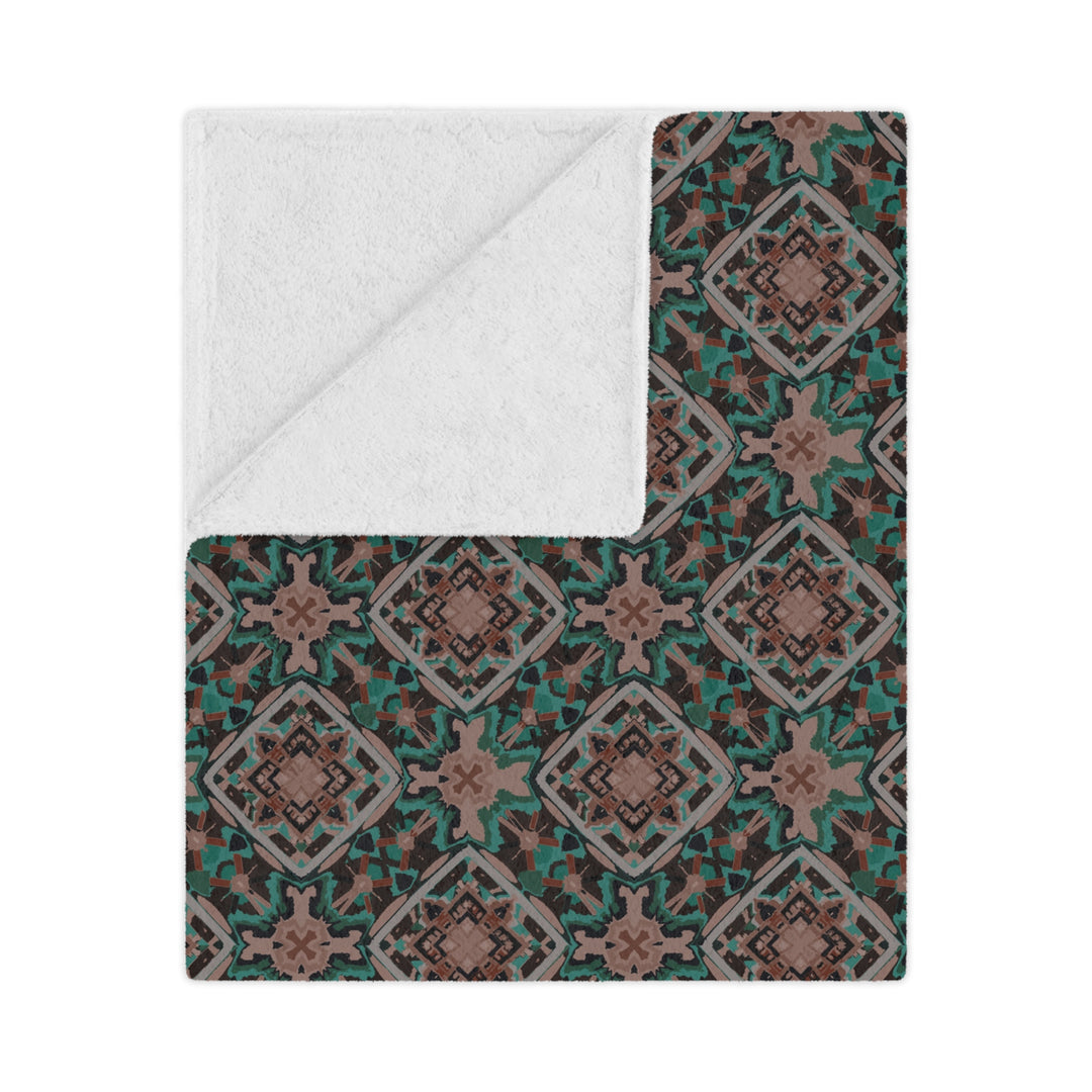 Patterned blanket with a white interior on a white background