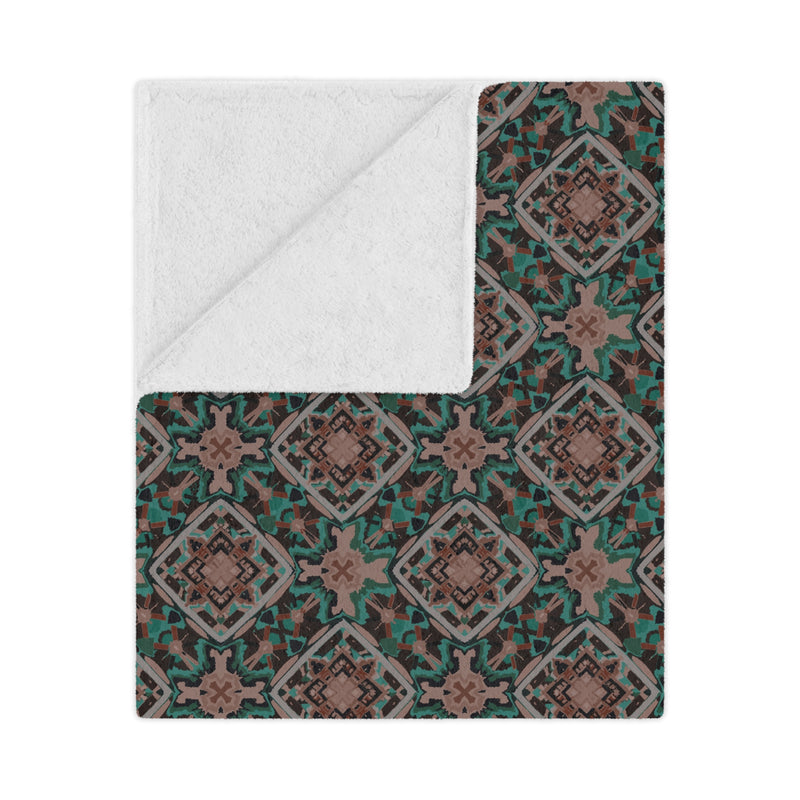 Patterned blanket with a white interior on a white background