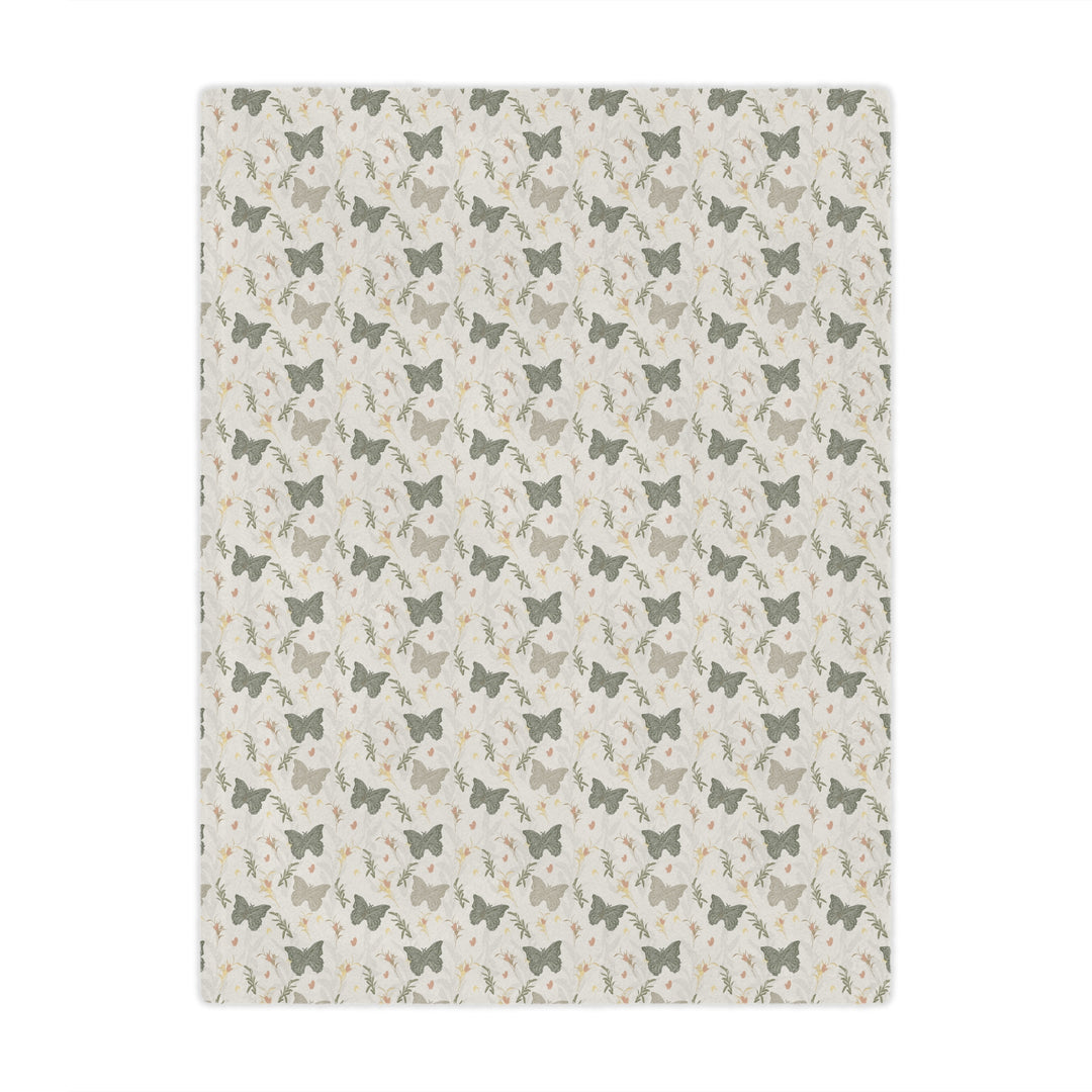 Patterned blanket with small butterfly  and butterfly design on a beige background