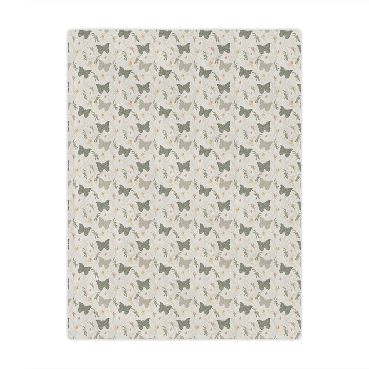 Patterned blanket with small butterfly  and butterfly design on a beige background