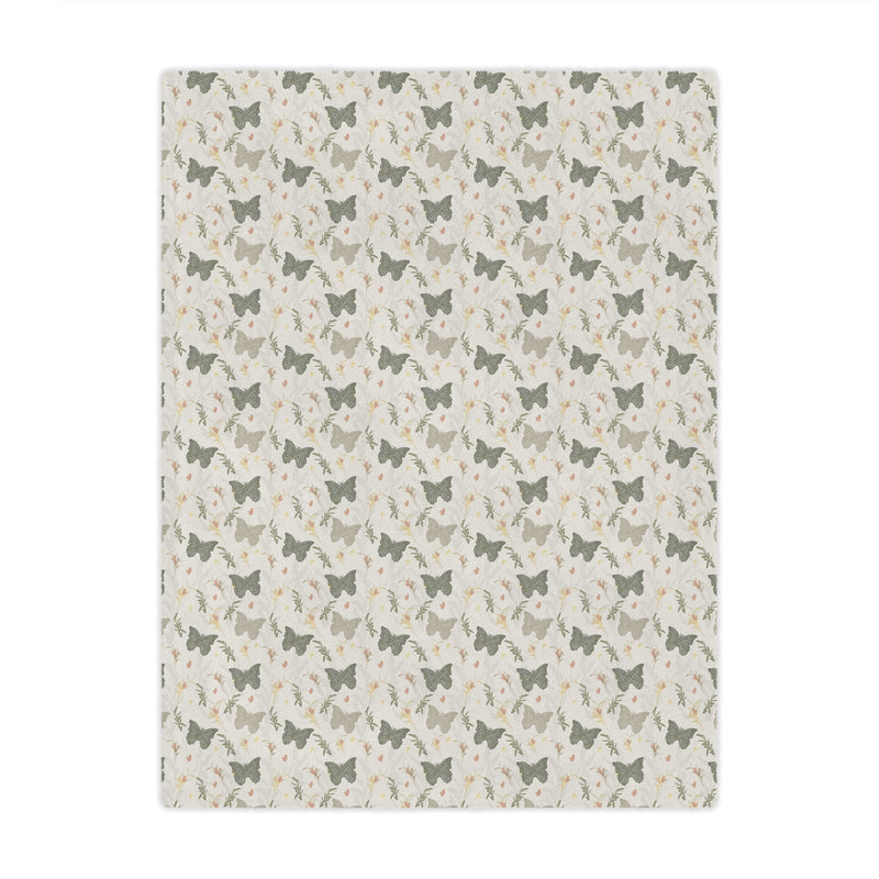Patterned blanket with small butterfly  and butterfly design on a beige background