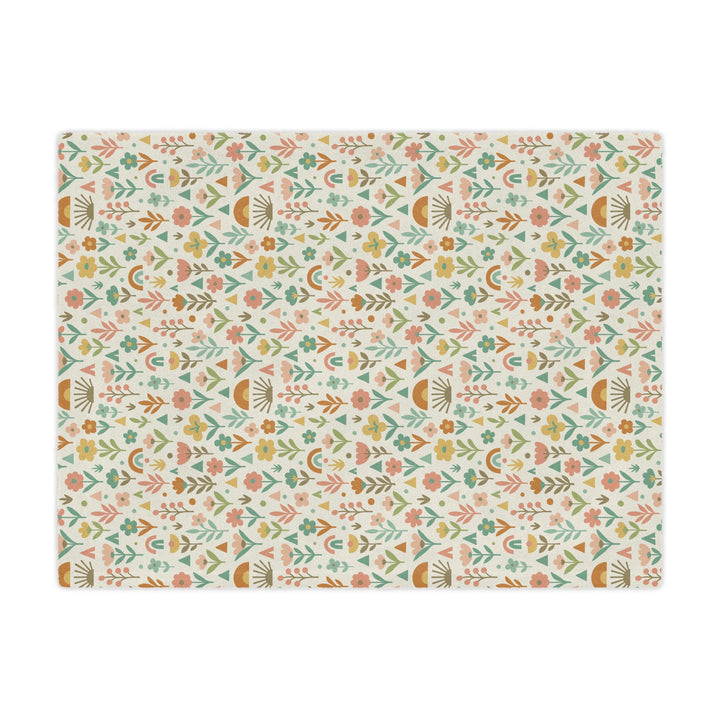 Patterned mat with floral and geometric design on a white background