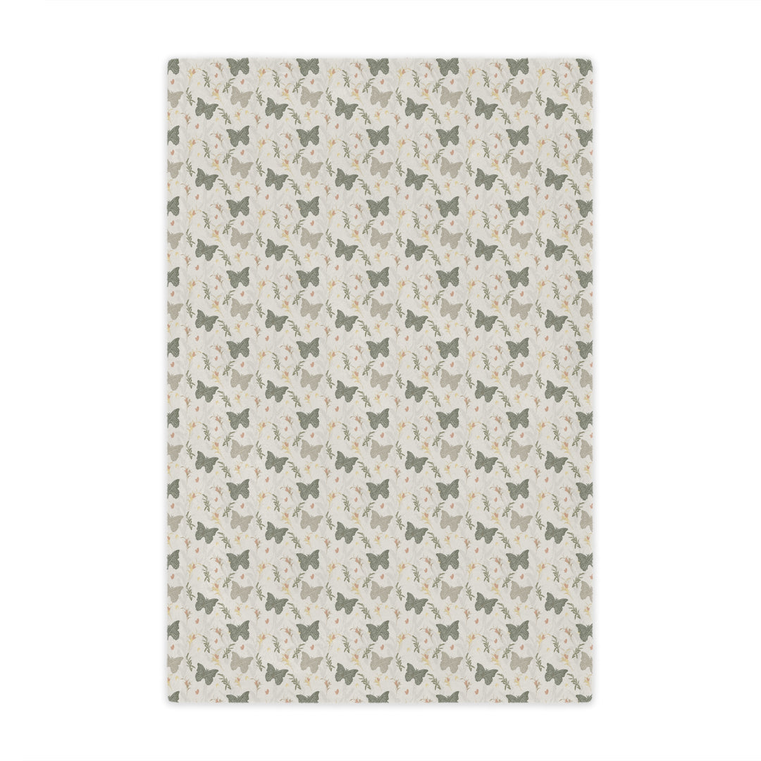 Patterned rug with small butterfly illustrations on a light background