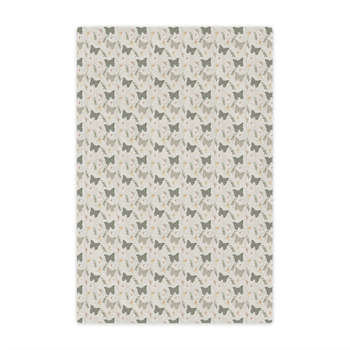 Patterned rug with small butterfly illustrations on a light background