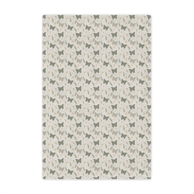 Patterned rug with small butterfly illustrations on a light background