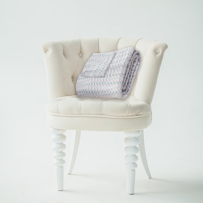 Quilted Throw Blanket – Elegant Lace-Inspired Damask Pattern -Timeless & Intricate on a chair