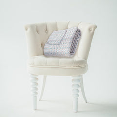 Quilted Throw Blanket – Elegant Lace-Inspired Damask Pattern -Timeless & Intricate on a chair
