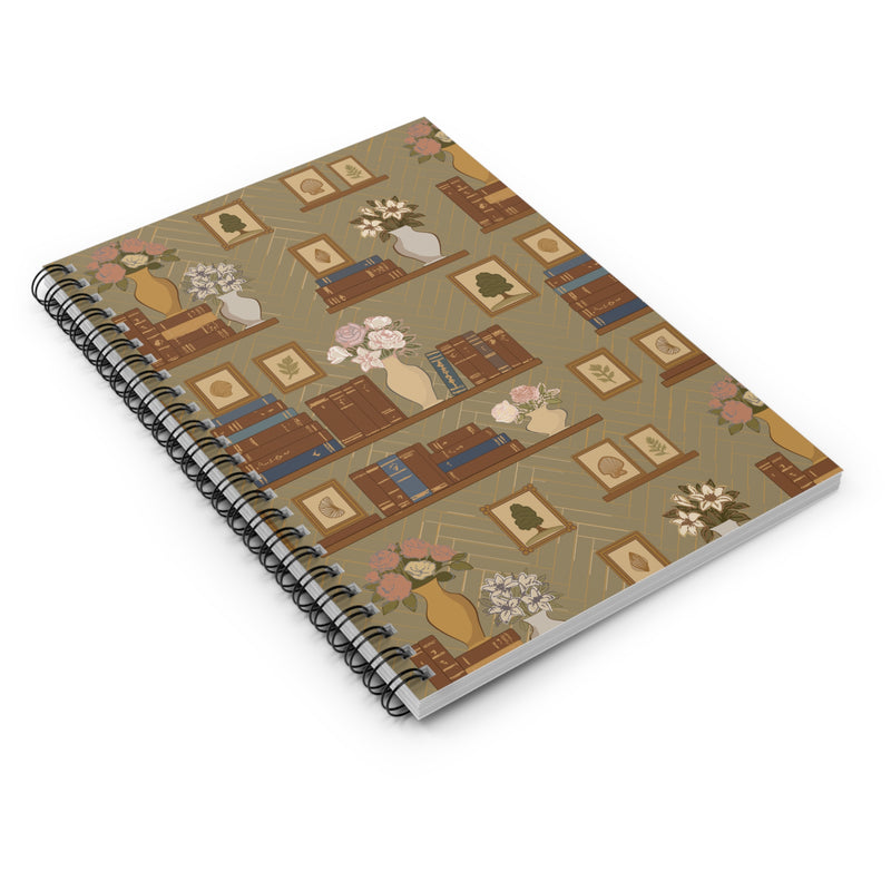 Spiral-bound notebook with decorative cover design on a white background