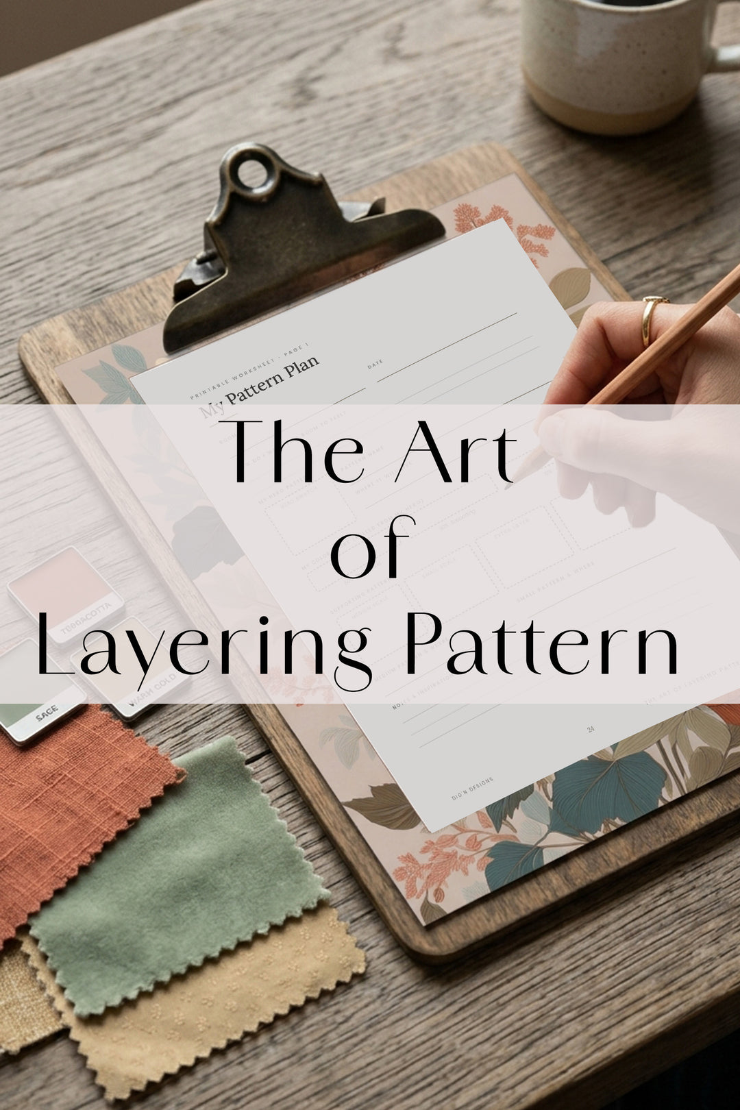 Printable pattern plan worksheet from The Art of Layering Pattern on a clipboard with fabric swatches