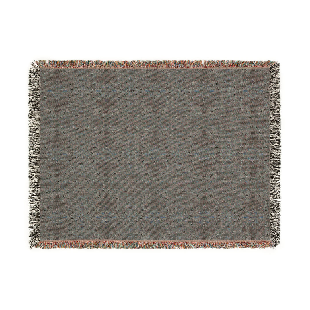 Textured blanket with a geometric pattern on a white background